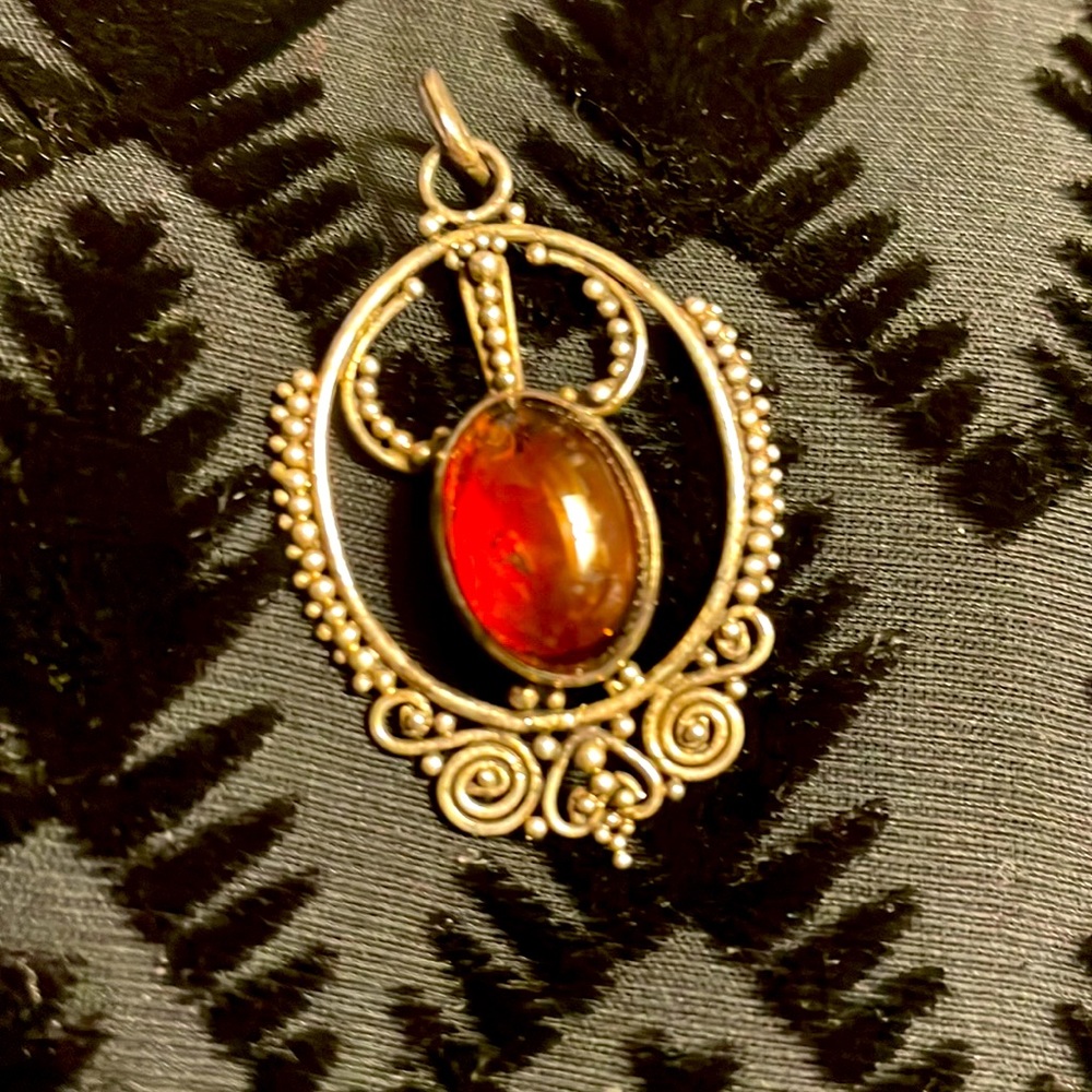 Genuine Amber and Sterling silver pendant.